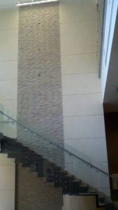 Beautiful glass staircase with cascade wall